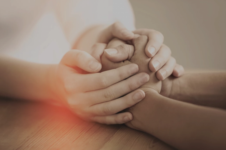 Two people holding hands.