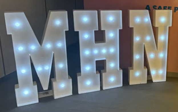 Giant lit up letters MHN.